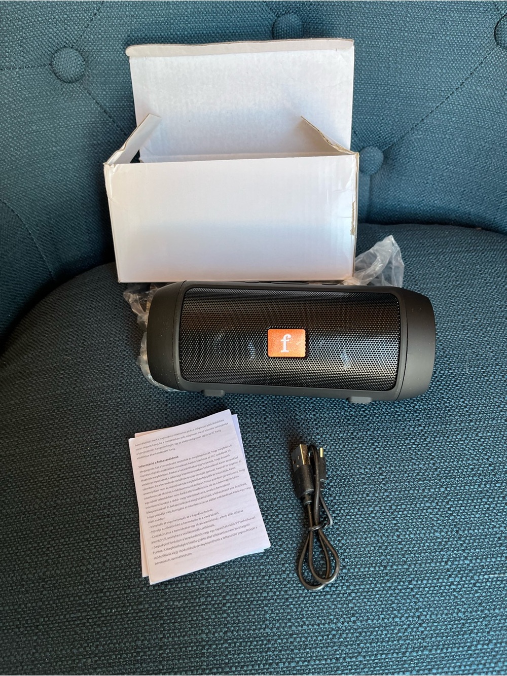 Portable Black Bluetooth Speaker with Orange Badge - Unknown Brand